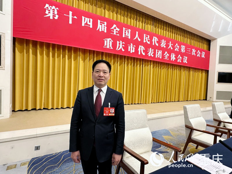 全國人大代表、重慶市人大民族宗教僑務外事委員會副主任委員錢建超。人民網記者 劉政寧攝